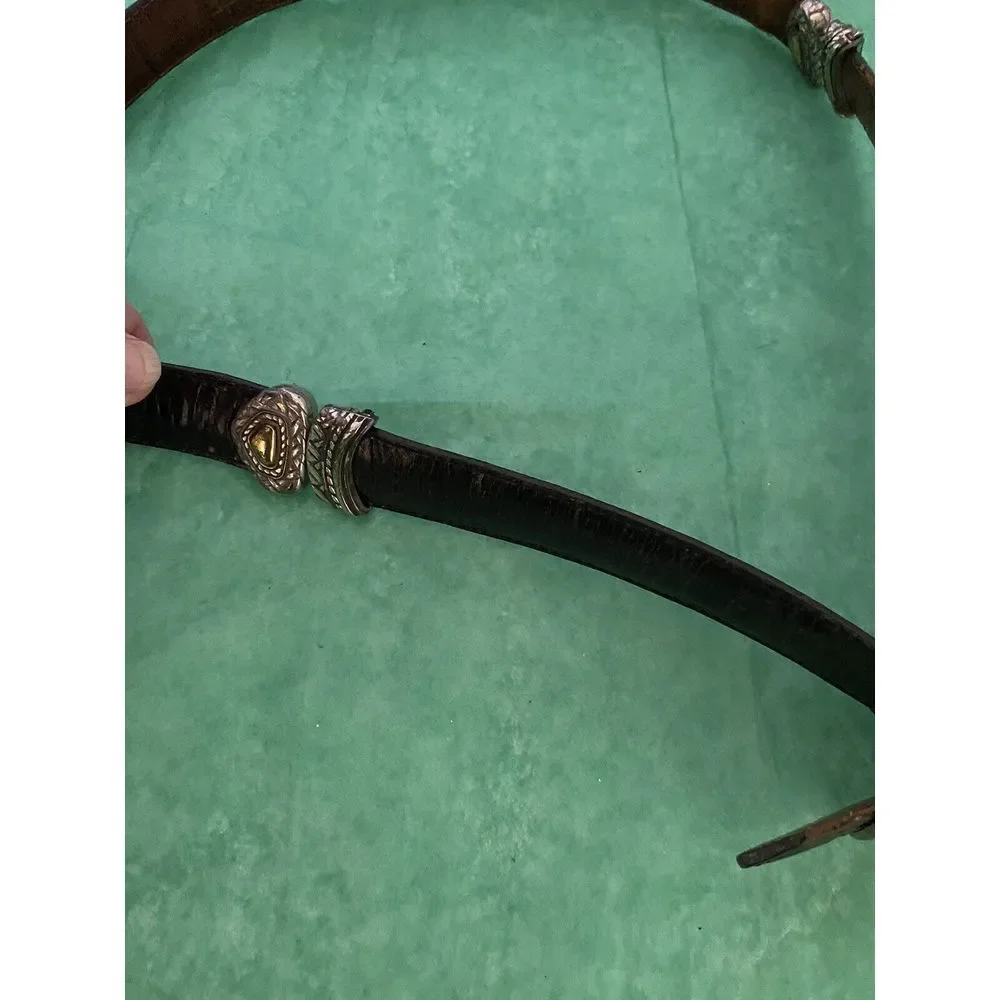 Ladies leather reversible belt black and brown with embellishments. Size med/30.